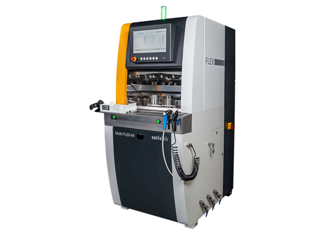 Automated industrial machine with integrated monitor and enclosed tool system for lens processing.