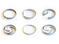 Set of six circular metal components with different spiral and ring-shaped designs, used in semiconductor equipment.