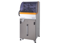 Compact automated industrial machine with transparent housing for precise manufacturing tasks