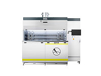 Front view of semiconductor processing equipment with enclosed chamber, transparent window, and ventilation unit.