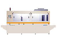 Front view of a large automated semiconductor processing machine with control panel and enclosed chambers.