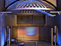 Interior of industrial machine with dome-shaped component and multiple mechanical parts