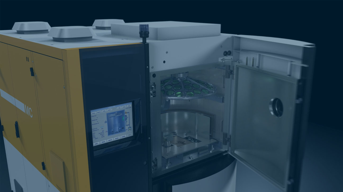 Open vacuum coating machine showing the interior chamber used for lens processing.