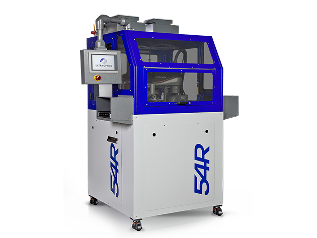 Compact industrial machine with blue frame and touchscreen control panel, used in lens production.